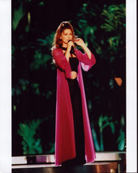 Shania Twain performing on stage in a black outfit and pink sheer robe photo print