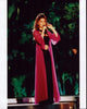 Shania Twain performing on stage in a black outfit and pink sheer robe photo print