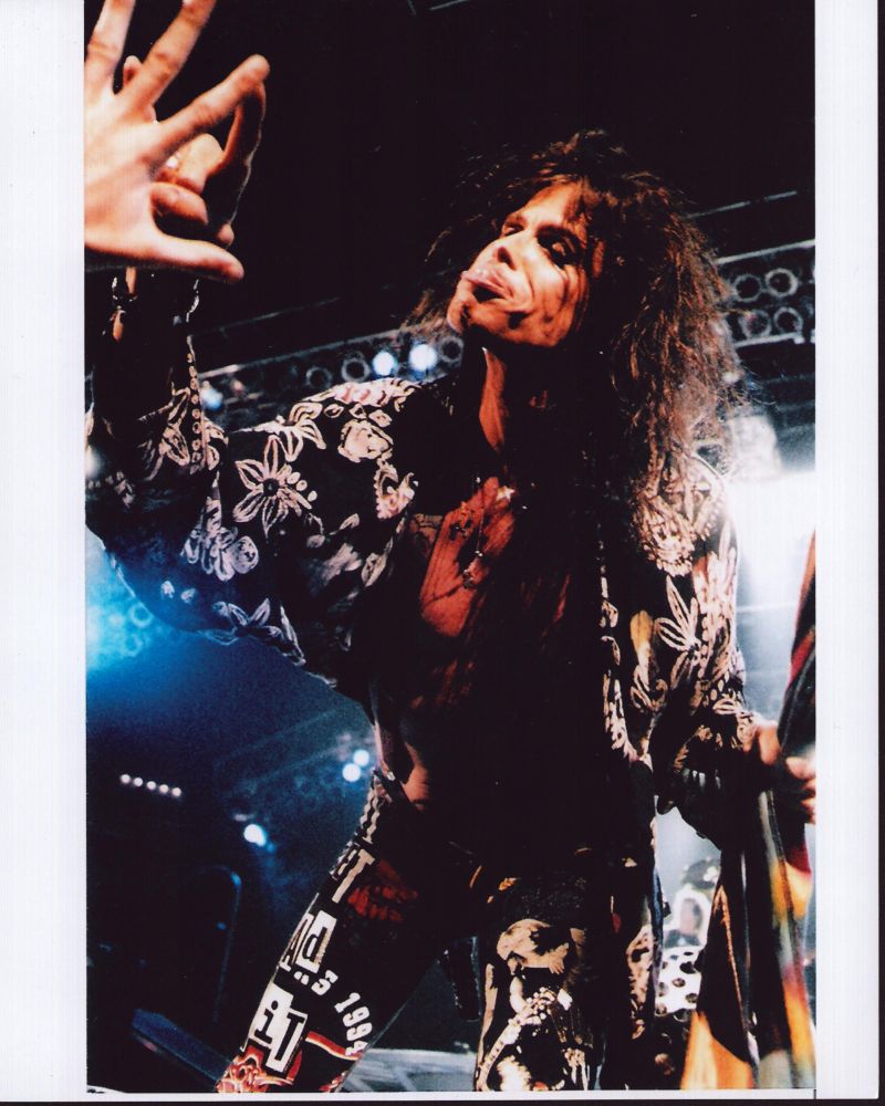 Steven Tyler on stage in black and white floral top photo print