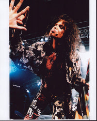 Steven Tyler on stage in black and white floral top photo print
