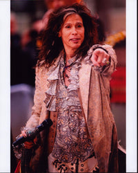 Steven Tyler pointing in a tan jacket with paisley ruffle top photo print.