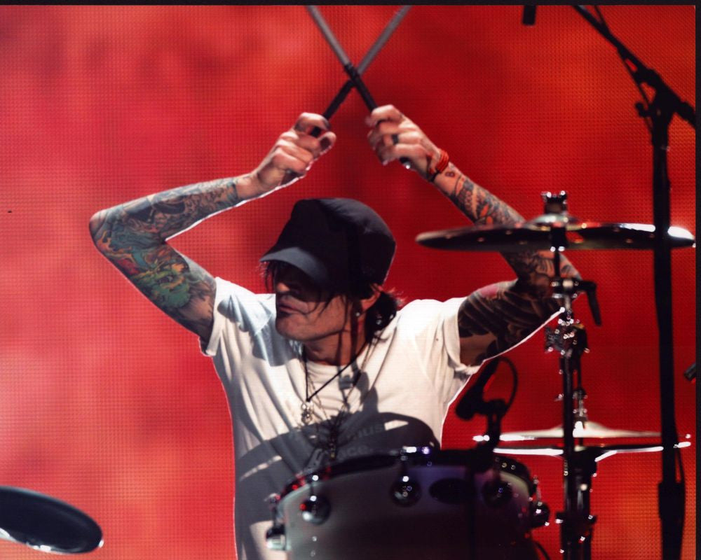 Tommy Lee Playing Drums Photo Print with Red Background - 8x10