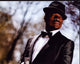 Ne-Yo Stylish Photo Print in Suit and Fedora - 8x10