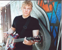 Jimmy Pinchak Playing Colorful Guitar Photo Print showcasing vibrant colors and artistic energy.