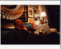 Quincy Jones Sitting On Couch Photo Print, capturing a legendary moment in music history.