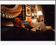 Quincy Jones Sitting On Couch Photo Print, capturing a legendary moment in music history.