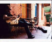 Jimmy Pinchak Playing Guitar at Table Photo Print