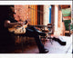 Jimmy Pinchak Playing Guitar at Table Photo Print