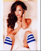 Brittney Alger wearing blue striped socks and white fur in a stylish photo print.