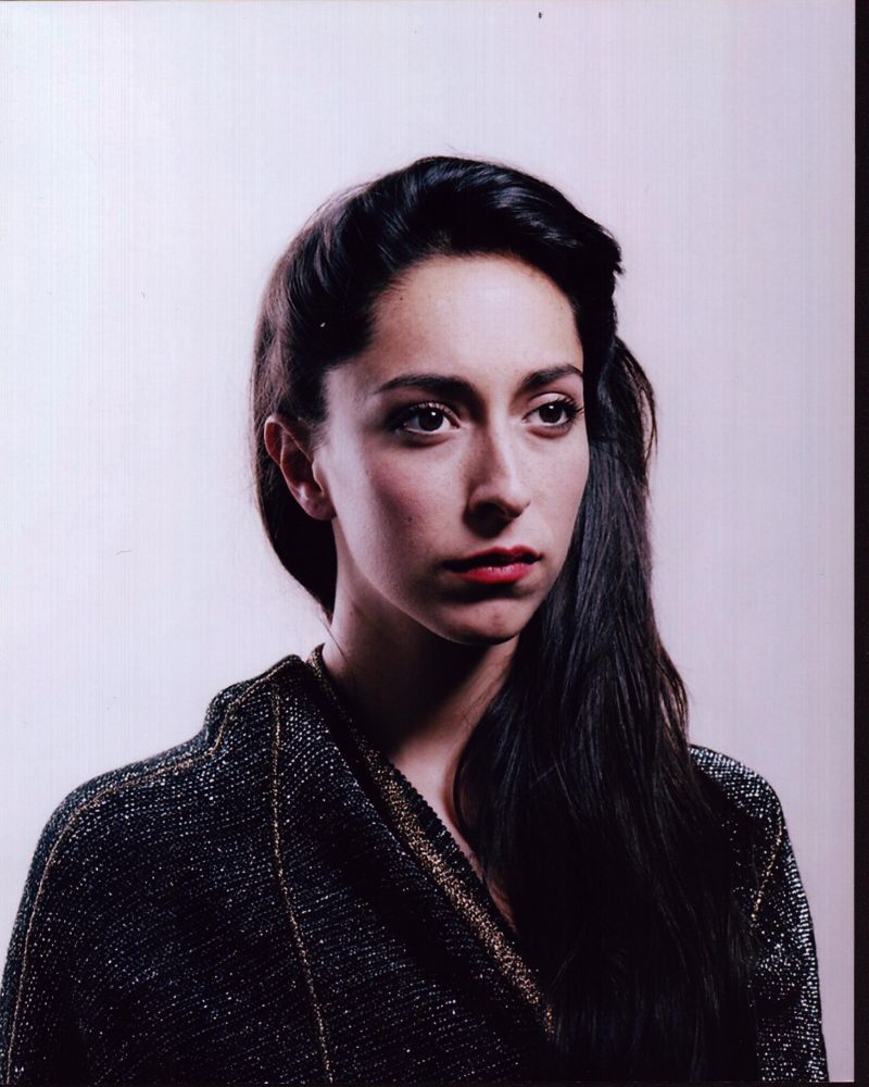 Oona Chaplin portrait photo print in black and gold sweater.