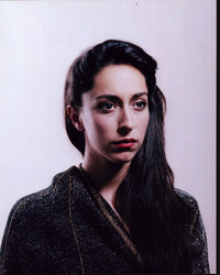 Oona Chaplin portrait photo print in black and gold sweater.