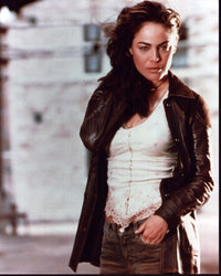 Yancy Butler in brown leather jacket and jeans photo print