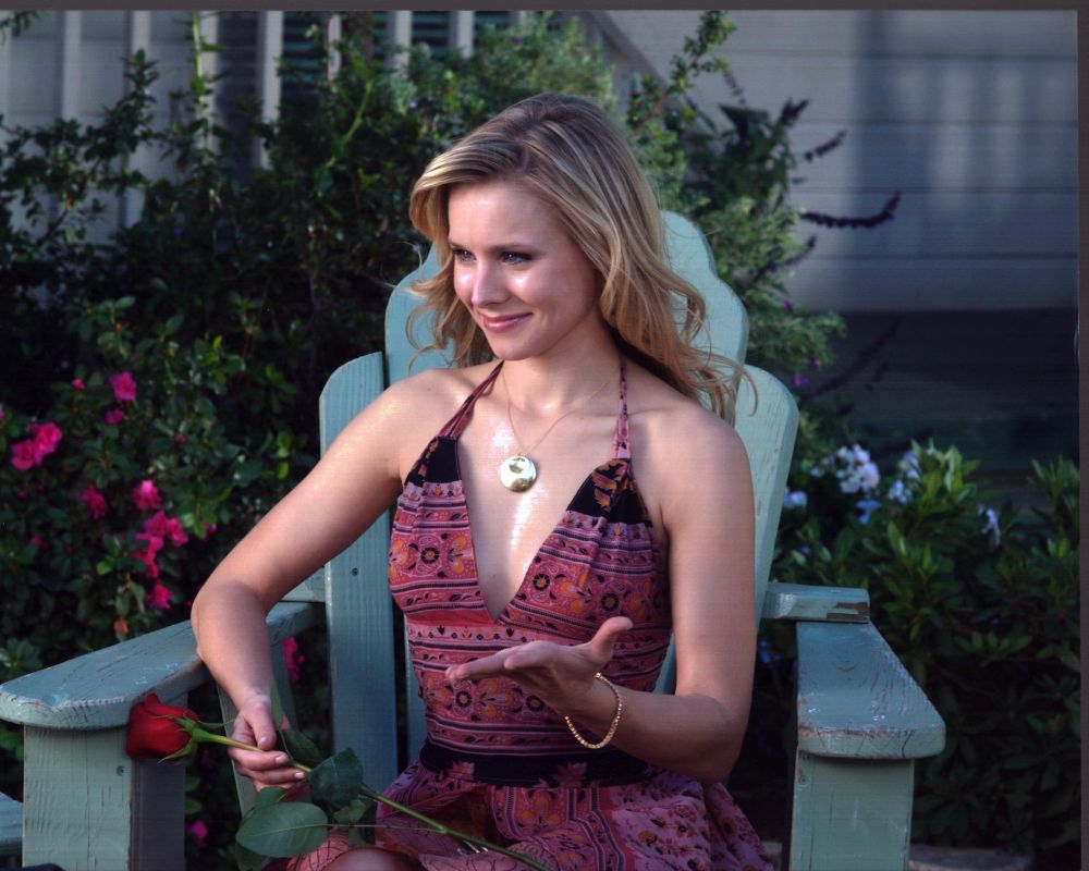 Kristen Bell holding a rose in Serious Moonlight photo print.