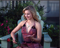 Kristen Bell holding a rose in Serious Moonlight photo print.