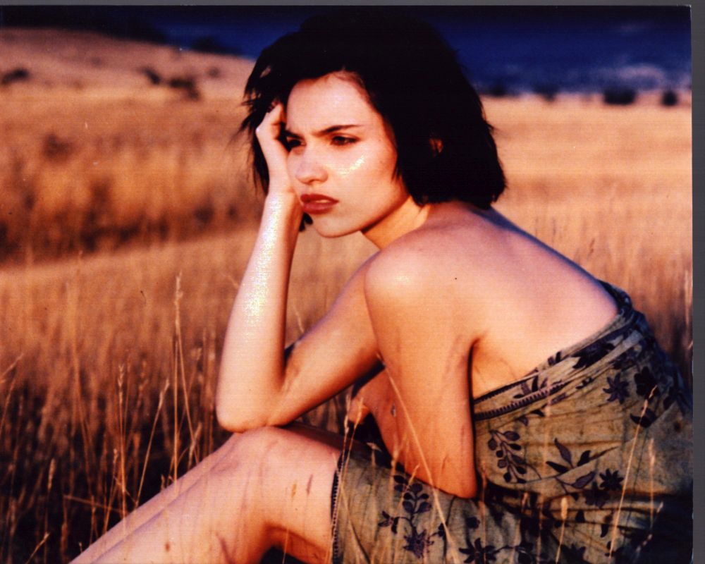 BéAtrice Dalle Sitting In Field Photo Print showcasing natural beauty.