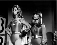 Deidre Hall and Judy Strangis in costume on the set of Electra Woman and Dyna Girl - Black and White Photo Print