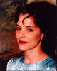 Parker Posey closeup photo print in blue snakeskin shirt.