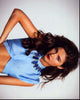 Stefanie Scott in blue cropped top photo print showcasing stylish pose.