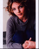 Close-up photo print of Camren Bicondova in gray top and jeans.
