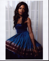 Naomie Harris photo print in blue strapless dress.