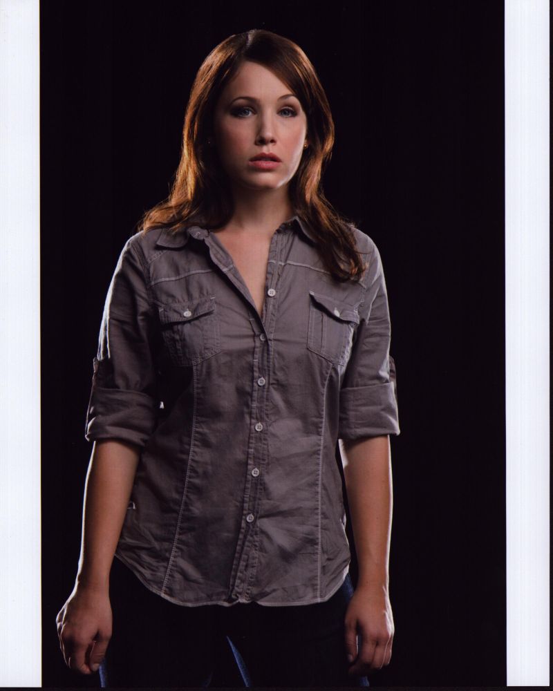 Marla Sokoloff photo print in tan button down shirt.