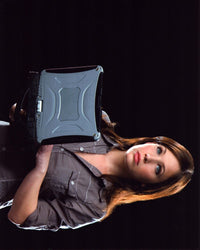 Marla Sokoloff holding a laptop photo print.