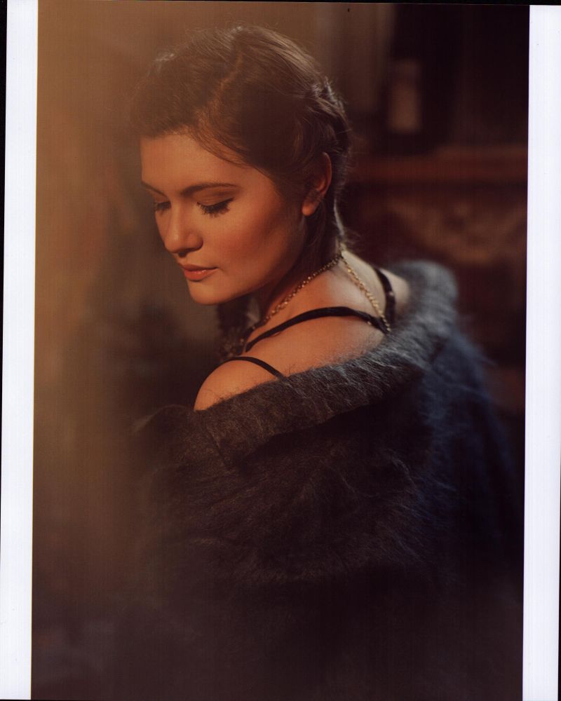 Phillipa Soo looking over shoulder in gray fuzzy jacket photo print.