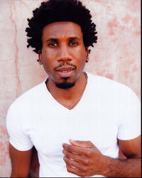 Nyambi Nyambi photo print featuring him in a white shirt.