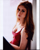 Erin Moriarty photo print leaning against wall in red tank top.