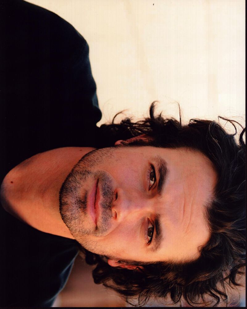 Daniel Hall headshot photo print featuring a black shirt, available in multiple sizes.