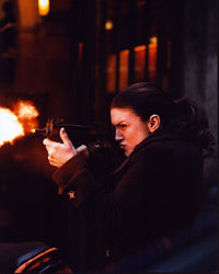 Gina Carano firing gun in Haywire photo print, action scene.