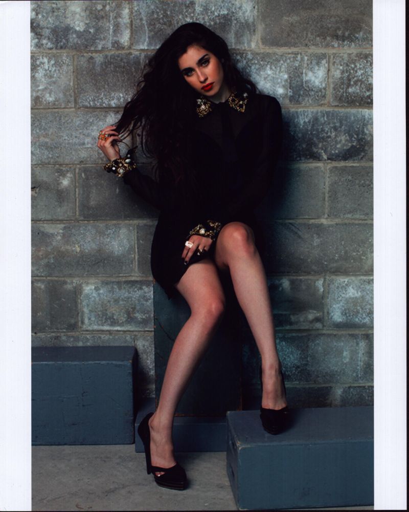 Lauren Jauregui in a black dress with gold collar photo print.