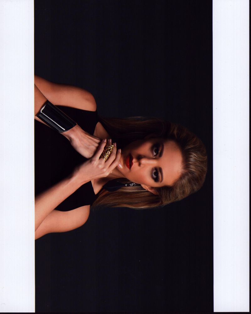 Fernanda Castillo in black with silver wrist cuff photo print.