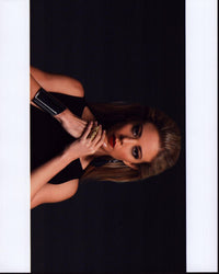 Fernanda Castillo in black with silver wrist cuff photo print.
