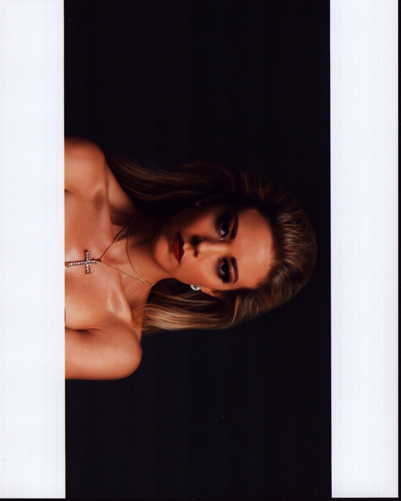 Fernanda Castillo closeup photo print featuring a cross necklace.
