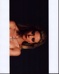 Fernanda Castillo closeup photo print featuring a cross necklace.