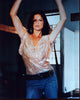 Jill Hennessy photo print in jeans and sheer top