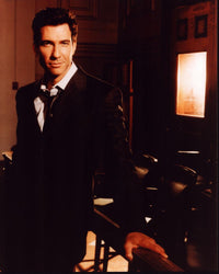 Dylan McDermott leaning on railing in a suit photo print