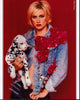 Alice Evans in denim jacket holding puppy photo print.