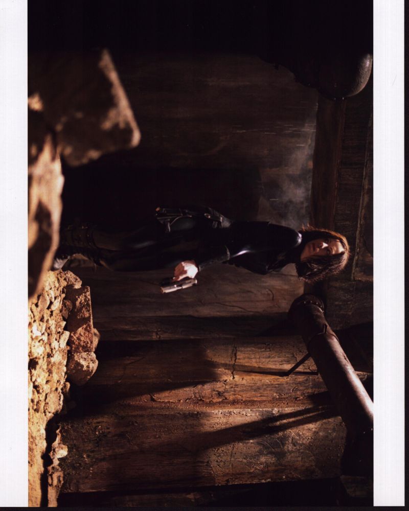Kate Beckinsale as Selene holding a gun in Underworld photo print.