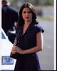 Andrea Gabriel in navy polka dot dress photo print.