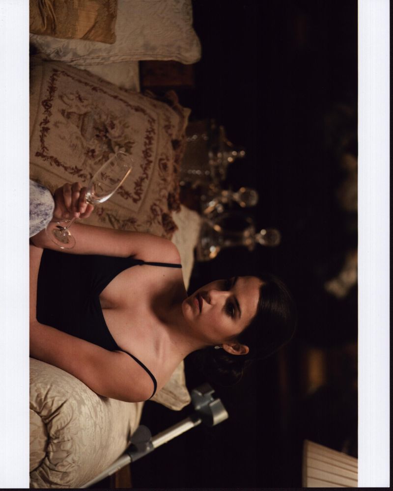 Melia Kreiling sitting on couch with glass - photo print