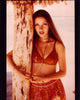 Jane Seymour leaning on a tree photo print, showcasing elegance and beauty.