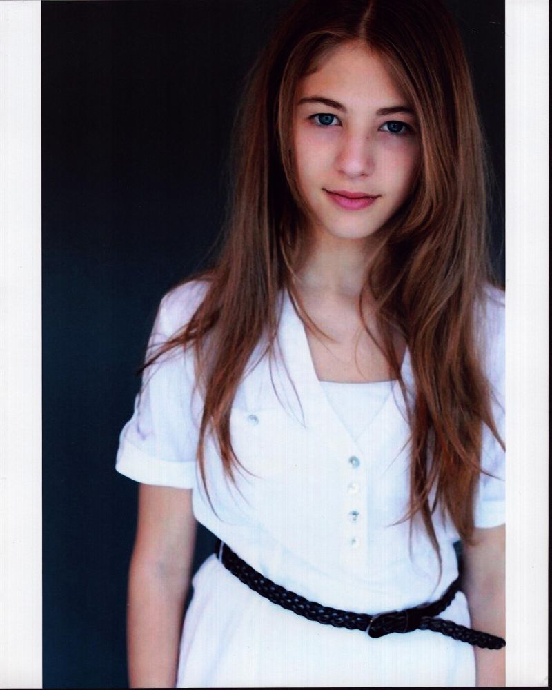 Madison McAleer in stylish white top with belt photo print
