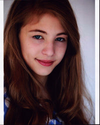 Madison McAleer headshot photo print in blue and white top.