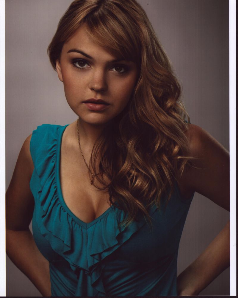 Aimee Teegarden in blue ruffle top photo print, stylish and elegant.