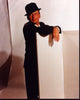 Frank Sinatra leaning against a wall, wearing a suit and fedora photo print.