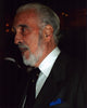 Christopher Lee in gray suit at an event photo print