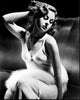 Susan Hayward black and white photo print of actress sitting with fur and hand in hair.
