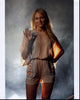 Jewel Waving In Patterned Romper Photo Print showcasing vibrant colors and intricate details.